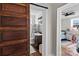 Bathroom with wood-look flooring, sliding barn door, and new fixtures at 134 Snowbird Loop, Statesville, NC 28625