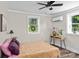 Cozy bedroom with dual windows, stylish decor, and wood-look flooring at 134 Snowbird Loop, Statesville, NC 28625