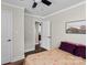 Bedroom featuring wood-look flooring, neutral walls and an ensuite bathroom at 134 Snowbird Loop, Statesville, NC 28625