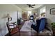 Bright living room features hardwood floors, neutral walls, large windows and stylish furnishings at 134 Snowbird Loop, Statesville, NC 28625