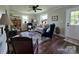 Inviting living room features hardwood floors, neutral walls, large windows and elegant furnishings at 134 Snowbird Loop, Statesville, NC 28625