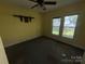 A view of the bedroom highlighting the window and ceiling fan at 1445 33Rd Sw St, Hickory, NC 28602