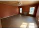 Bedroom featuring hardwood floors, two windows, and ceiling fan at 1445 33Rd Sw St, Hickory, NC 28602