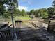 Spacious wooden deck offering a scenic view of the backyard and lush greenery at 1445 33Rd Sw St, Hickory, NC 28602