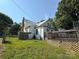 Charming two-story home with a classic white exterior and a brick chimney on a sunny day at 1445 33Rd Sw St, Hickory, NC 28602