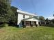 Two-story home with white siding and a covered front porch with a swing at 1445 33Rd Sw St, Hickory, NC 28602