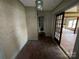 Hallway with wood floors and view into a kitchen at 1445 33Rd Sw St, Hickory, NC 28602