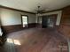 Empty living room with wood floors, wood trim and a ceiling fan at 1445 33Rd Sw St, Hickory, NC 28602