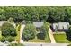 Aerial view of a home showcasing its position within a neighborhood with mature tree coverage at 147 35Th Ne Ave, Hickory, NC 28601