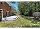 Private backyard featuring a spacious yard, wooden fence, and deck perfect for outdoor relaxation at 147 35Th Ne Ave, Hickory, NC 28601