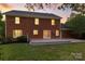 Two-story brick house with a wooden deck that overlooks the grassy backyard at 147 35Th Ne Ave, Hickory, NC 28601