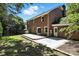 Brick house with a chimney and a deck in the backyard under a blue sky at 147 35Th Ne Ave, Hickory, NC 28601