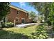 Charming backyard with a brick house, well-manicured lawn, and a spacious deck for outdoor entertaining at 147 35Th Ne Ave, Hickory, NC 28601