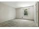 Neutral bedroom featuring a window with a view of trees and a closet at 147 35Th Ne Ave, Hickory, NC 28601
