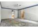 Bedroom with ceiling fan with views of a bathroom and hallway at 147 35Th Ne Ave, Hickory, NC 28601