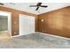 Carpeted bedroom features a ceiling fan and a closet with white doors at 147 35Th Ne Ave, Hickory, NC 28601