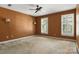 Spacious bedroom with two shuttered windows, neutral carpet, and warm colored walls at 147 35Th Ne Ave, Hickory, NC 28601