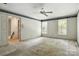 Bedroom with windows featuring shutters and a glimpse of the open doorway at 147 35Th Ne Ave, Hickory, NC 28601