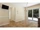 A dining area is complemented by a chandelier and includes a view into the living area at 147 35Th Ne Ave, Hickory, NC 28601