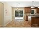 A dining area offers a chandelier and access to an outdoor deck through sliding glass doors at 147 35Th Ne Ave, Hickory, NC 28601