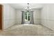 Bright dining room featuring a chandelier, large window, and neutral walls at 147 35Th Ne Ave, Hickory, NC 28601