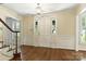Bright foyer featuring hardwood floors, a white front door, and classic trim at 147 35Th Ne Ave, Hickory, NC 28601
