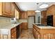 Spacious kitchen featuring light wood cabinets, laminate countertops and island with built in cooktop at 147 35Th Ne Ave, Hickory, NC 28601