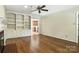 Spacious living room with hardwood floors, a fireplace, and custom built-in shelves at 147 35Th Ne Ave, Hickory, NC 28601
