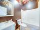 Cozy bathroom featuring a white vanity, toilet, and shower-tub combo, offering functionality at 1508 Avalon Oaks Ct, Dallas, NC 28034