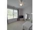 Bedroom with large window, TV, full-length mirror, and white carpet creating a comfy atmosphere at 1508 Avalon Oaks Ct, Dallas, NC 28034