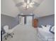 Bonus room with grey walls, carpet, a window, and an assortment of furniture and a ceiling fan at 1508 Avalon Oaks Ct, Dallas, NC 28034