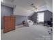 Bonus room with grey walls, carpet, a window, and an assortment of furniture and a ceiling fan at 1508 Avalon Oaks Ct, Dallas, NC 28034