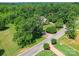 Exterior of a two-story house with a mature tree in the front yard, surrounded by lush greenery at 1508 Avalon Oaks Ct, Dallas, NC 28034