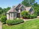 Stunning brick home features lush landscaping and a welcoming front entrance at 1508 Avalon Oaks Ct, Dallas, NC 28034