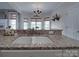 The kitchen features granite countertops, a stainless faucet and sink, and large windows bringing in natural light at 1508 Avalon Oaks Ct, Dallas, NC 28034