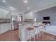 Modern kitchen with granite countertops and stainless steel appliances adjoins living area at 1508 Avalon Oaks Ct, Dallas, NC 28034