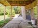 View of a shady patio with brick, outdoor seating, and well-maintained lawn, perfect for relaxation at 1508 Avalon Oaks Ct, Dallas, NC 28034
