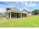 A large backyard features a covered patio and ample green space, perfect for outdoor activities at 163 Crenshaw Nw Pl, Concord, NC 28027