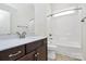 Bathroom featuring vanity, bath tub and shower with modern fixtures and finishes at 163 Crenshaw Nw Pl, Concord, NC 28027