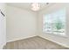 Bright bedroom with large window allowing for ample natural light and neutral carpeting at 163 Crenshaw Nw Pl, Concord, NC 28027