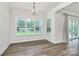 Well-lit dining area with large window and view to the backyard at 163 Crenshaw Nw Pl, Concord, NC 28027