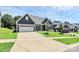 A well-maintained home with an inviting front yard and ample driveway space at 163 Crenshaw Nw Pl, Concord, NC 28027