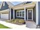 Home exterior featuring a well-manicured landscape, inviting front entrance with columns at 163 Crenshaw Nw Pl, Concord, NC 28027