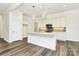 Modern kitchen island features a sink and marble countertops at 163 Crenshaw Nw Pl, Concord, NC 28027