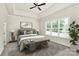 Relaxing main bedroom features tray ceiling, a large window, and neutral tones at 163 Crenshaw Nw Pl, Concord, NC 28027
