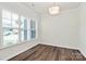 Office space with abundant natural light from large windows, complemented by stylish wood floors at 163 Crenshaw Nw Pl, Concord, NC 28027