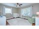 Bright Bedroom with a crib, soft green chair, and large windows for plenty of natural light at 1715 Wensley Dr, Charlotte, NC 28210