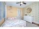Bright bedroom with a playful theme, comfortable bed, and ample storage space perfect for a room at 1715 Wensley Dr, Charlotte, NC 28210
