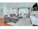 Inviting living room filled with natural light, showcasing elegant furnishings and hardwood floors at 1715 Wensley Dr, Charlotte, NC 28210
