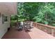 Spacious back deck perfect for entertaining, overlooking lush trees and a peaceful outdoor setting at 173 Rocky River Rd, Mooresville, NC 28115